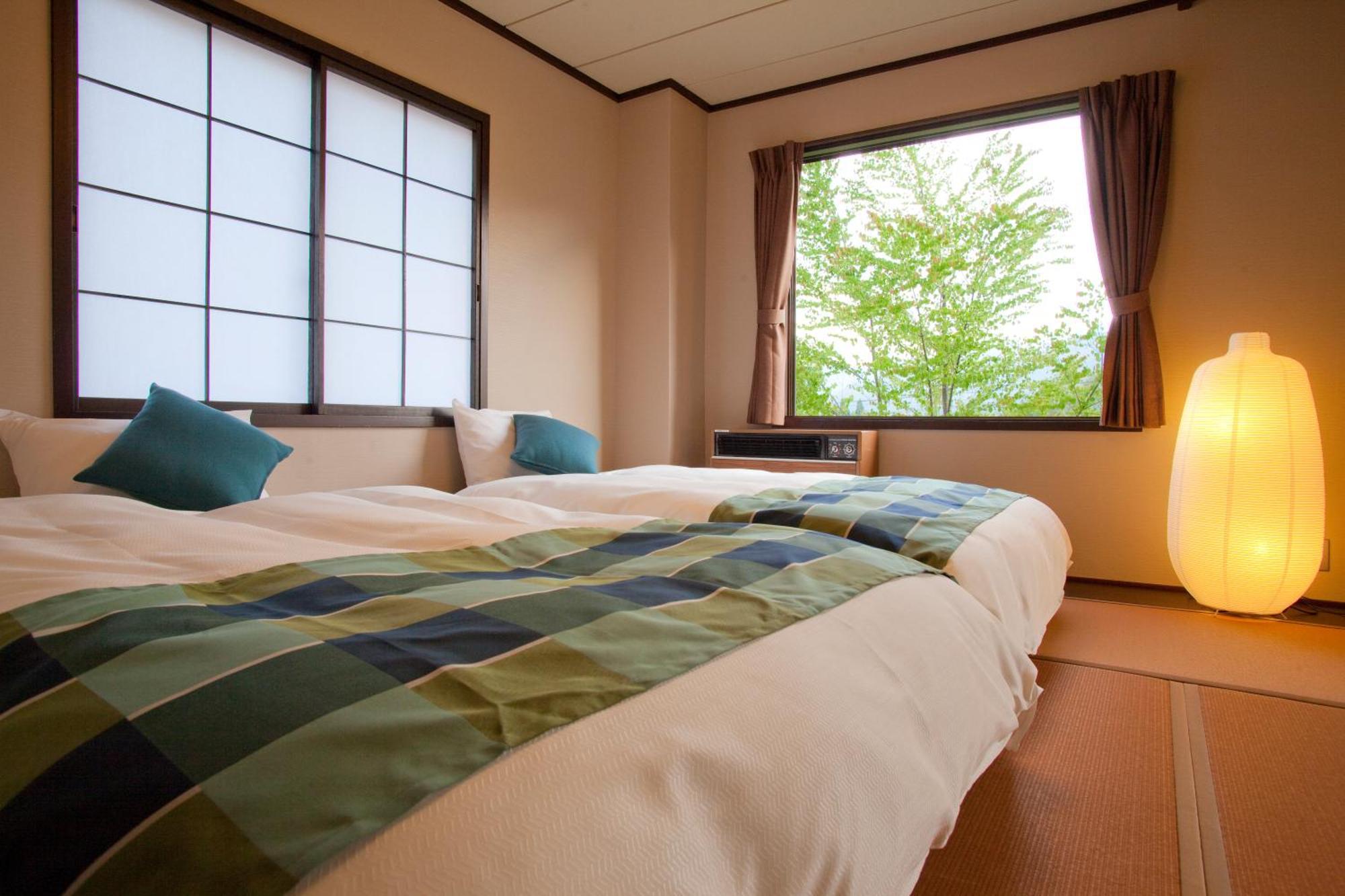 Hotel Hakuba Berghaus Отари Номер фото